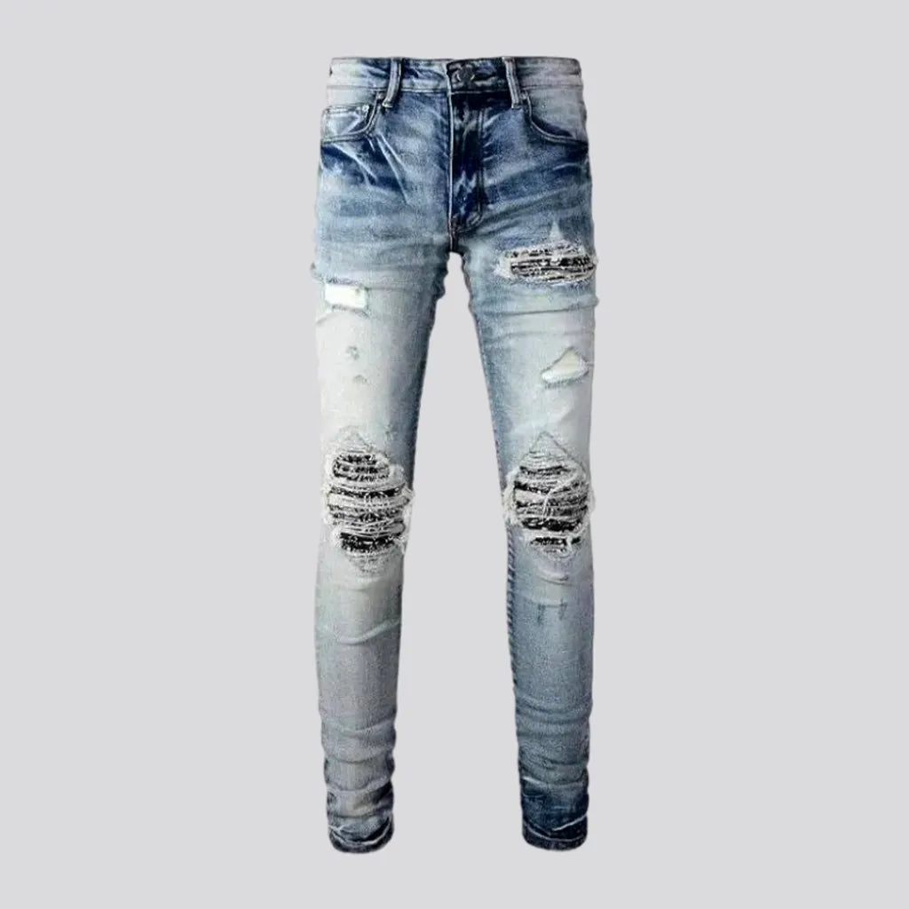 Patchwork men's whiskered jeans